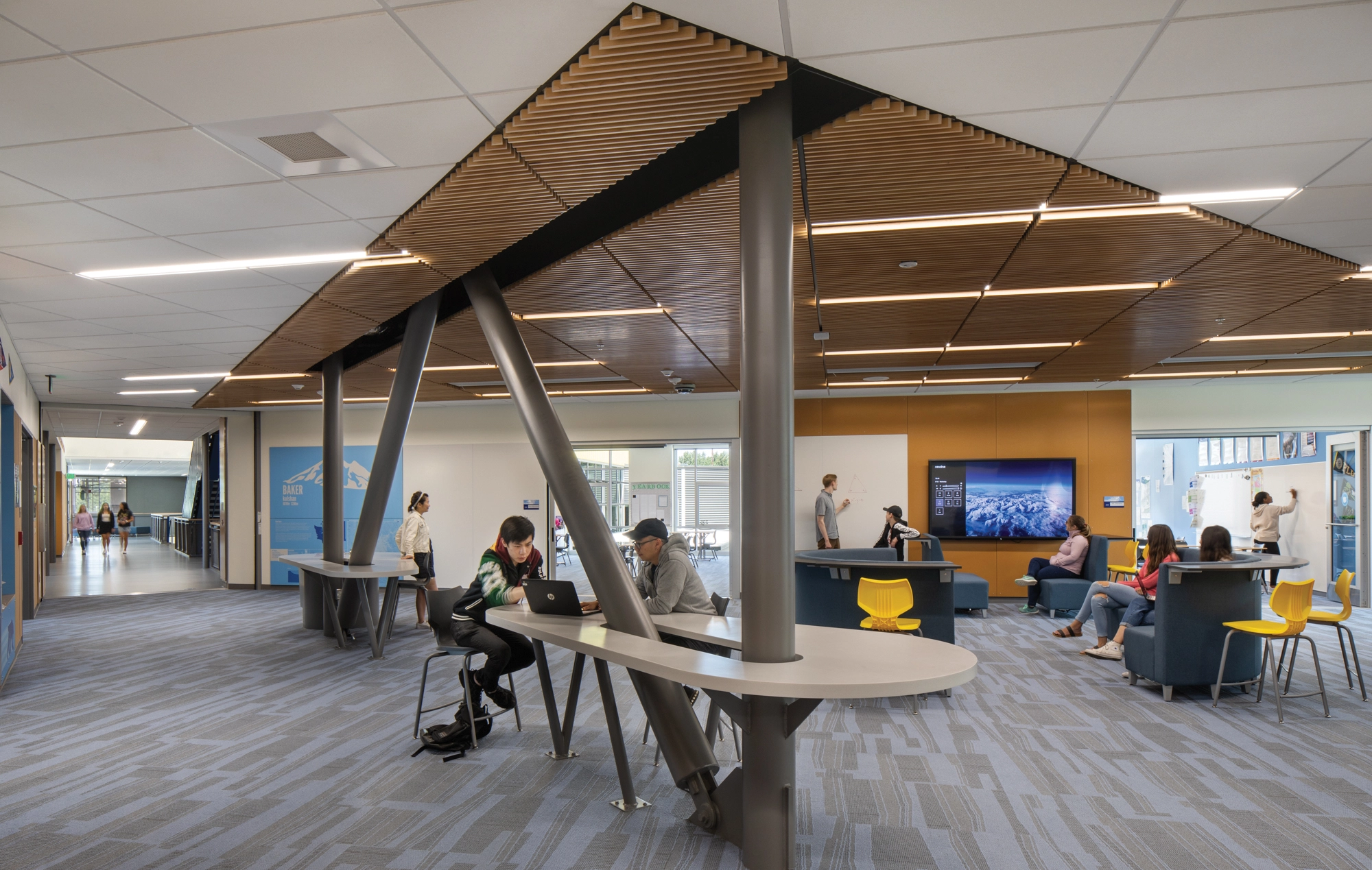 At Surprise Lake Middle School in Milton, WA, shared learning areas surrounded by classrooms serve each interdisciplinary cohort, providing a sense of community and identity while also supporting social learning and student agency. Photo: Lara Swimmer