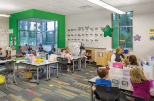 Sunset Primary School. West Linn, Oregon. This classroom enables a variety of activities: independent reading in a window nook, groups working collaboratively at tables, and a place where the teacher can provide individualized reading instruction. Photo: Josh Partee