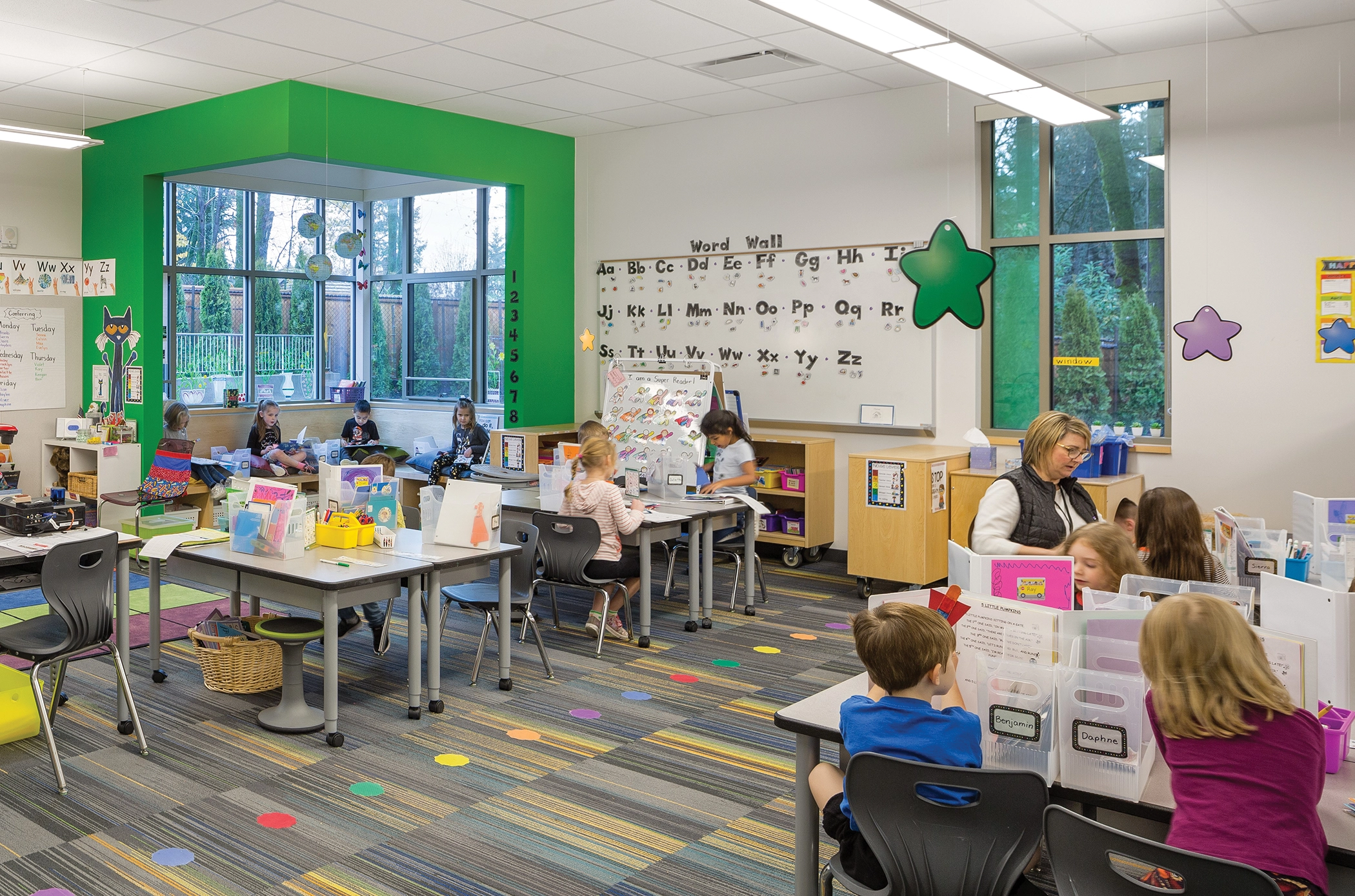 Sunset Primary School. West Linn, Oregon. This classroom enables a variety of activities: independent reading in a window nook, groups working collaboratively at tables, and a place where the teacher can provide individualized reading instruction. Photo: Josh Partee