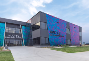 The MOC-FV Elementary School has a unique light-interference, stainless steel façade that showcases the vibrant imagination of kids, while utilizing durable materials to withstand Midwest weather conditions. Photo: Paul Brokering Photography